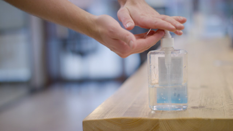 Close-up-of-Male-Cleaning-Hands-Using-Hand-Sanitiser